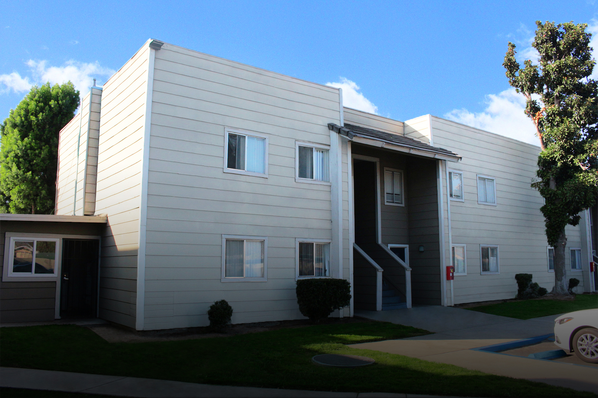 This image shows the exterior banner photo of Village Square Apartments