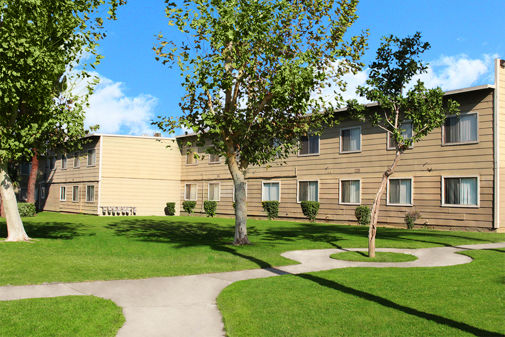 This image shows the exterior photo of Village Square Apartments Apartments